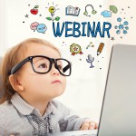 Webinar concept with toddler girl using her laptop